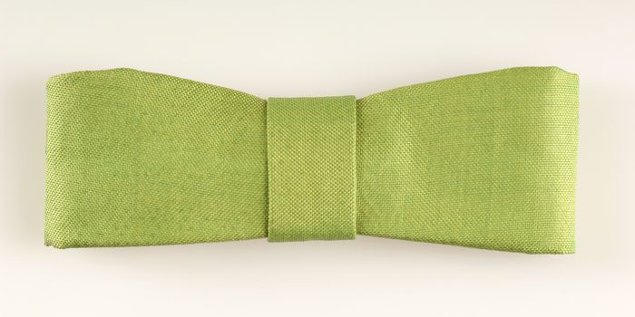 green rectangular tie-bow on a white background isolated, top view