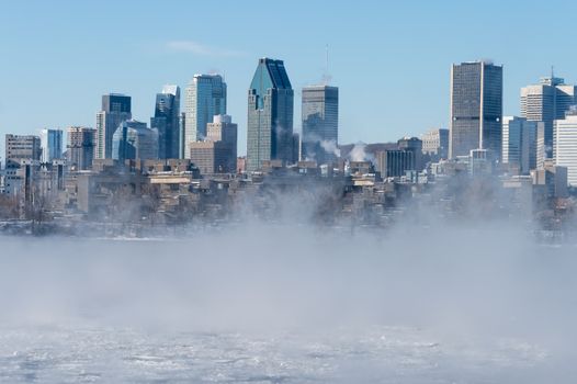 Montreal Skyline in winter as ice fog rises off the St. Lawrence River