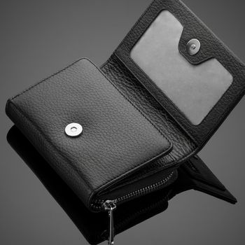 Fashionable leather men's wallet on a dark background