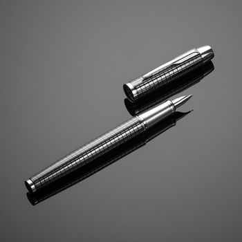fashionable ink pen on a black background