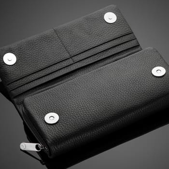 Fashionable leather men's wallet on a dark background