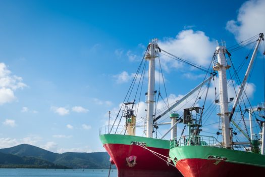 Cargo ship or fishing boat docked at jetty in Songkhla deep sea port.