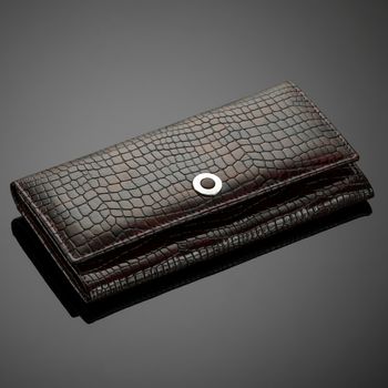 Fashionable leather men's wallet on a dark background