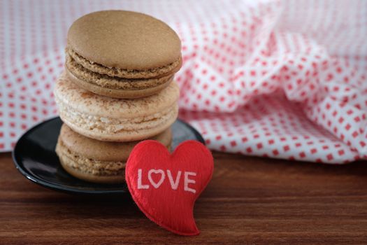 Chocolate and coffee macaroons  on wooden background, AF point selection, copy space for write.