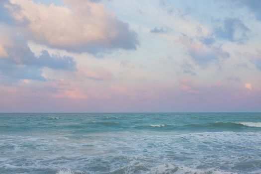 Beautiful pastel sunset sky with cloudscape over the Songkhla ocean.