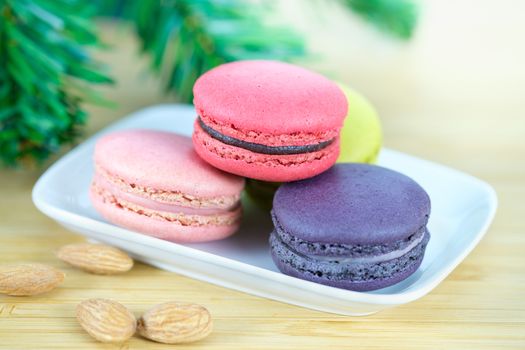 Sweet and colorful macaroons cookies on wooden background with blank space,selective focus, Dessert.