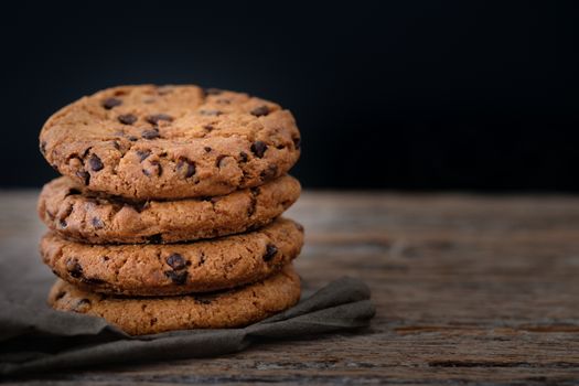 Chocolate chip cookies stacked up on a plate in low light, 
AF point selection