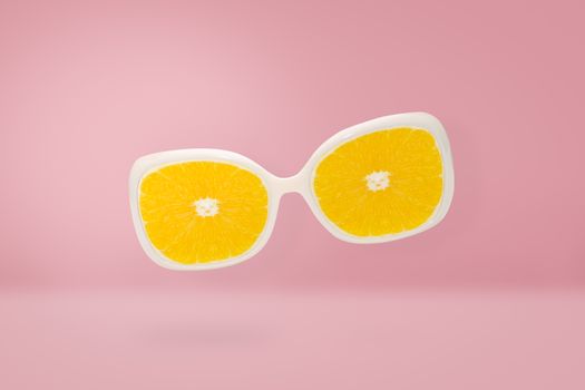 Beach sunglasses  with orange lens on pink pastel, summer concept and minimal style.