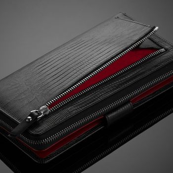 Fashionable leather men's wallet on a dark background