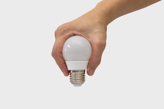 Hand holding a light bulb shape isolated on white background.