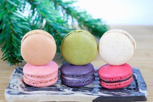 Sweet and colorful macaroons cookies on wooden background with blank space,selective focus, Dessert.