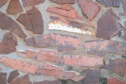 Old brick wall in antiquity and was damaged by the time until the mortar fell.