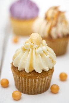 Tasty mini cupcakes on a vintage background, sweet dessert for christmas, new year and valentine holliday.