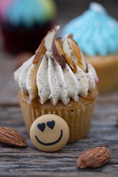 Tasty mini cupcakes on a vintage background, sweet dessert for christmas, new year and valentine holliday.