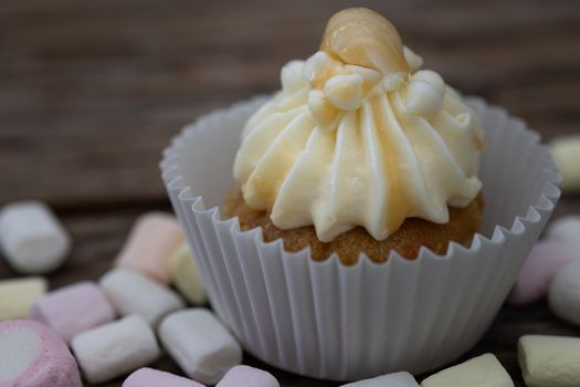 Tasty mini cupcakes on a vintage background, sweet dessert for christmas, new year and valentine holliday.