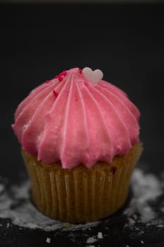 Tasty mini cupcakes on a vintage background, sweet dessert for christmas, new year and valentine holliday.