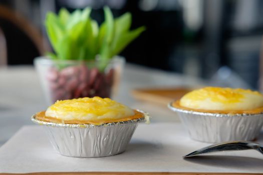 Dessert egg tart sweet custard pie on table, AF point selection.