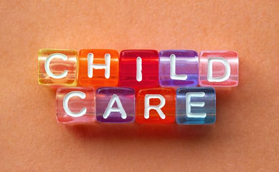 Child Care, message in text in colorful cubes on orange background