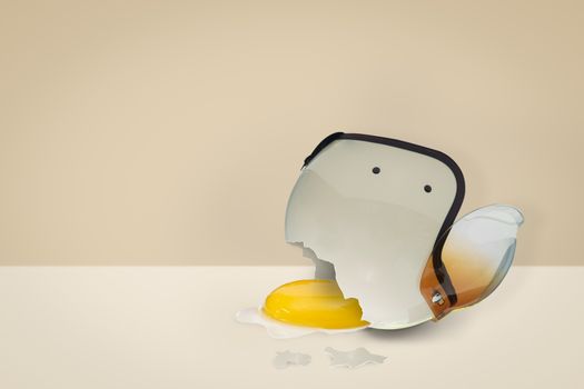 The helmet bumps until it breaks, with the yolk flowing out. Safety concept, minimal style.