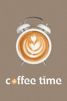 Hot coffee with frothy foam in white alarmclock design is Coffee Time Concept