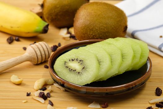 Kiwi slices were placed on a ceramic plate