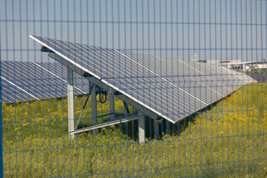 Grin clean electric power - Solar panel outside on grass photovoltaic