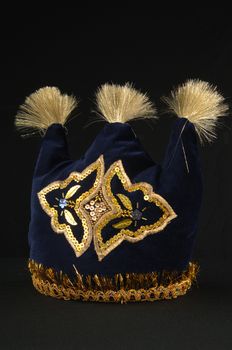 colorful traditional asian skullcap cap on a dark background