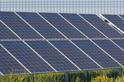 Grin clean electric power - Solar panel outside on grass photovoltaic