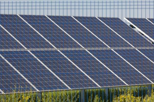 Grin clean electric power - Solar panel outside on grass photovoltaic