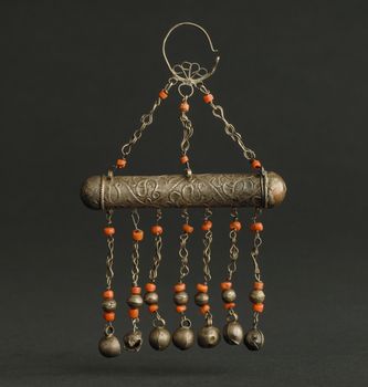 ancient antique pendant with stones on black background. Middle-Asian vintage jewelry