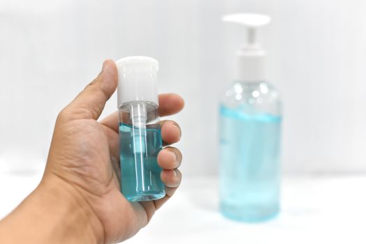 gel alcohol in Hand On a white background or spray alcohol anti bacteria to prevent spread of germs, bacteria and virus. and avoid infections corona virus. Hygiene concept. antibacterial gel sanitizer. 