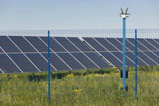 Grin clean electric power - Solar panel outside on grass photovoltaic