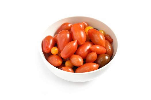 Cherry tomatoes.Cherry tomatoes in ceramic bowl  isolated on white background. Top view. selective focus