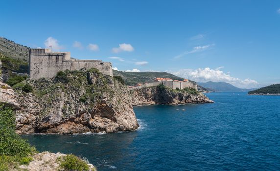 Panorama of the cliffside under Fort Lawrence and city walls of the old town in Dubrovnik