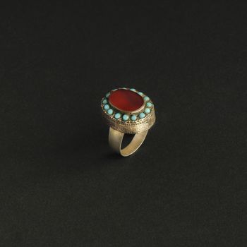 ancient antique ring with stones on black background. Middle-Asian vintage jewelry