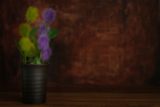 Still life with flower in the pottery vase on rustic wooden table, Choose a focal point, copy space for write.
