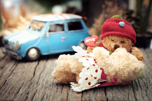 Teddy bear kiss his girlfriend in warm light tone, AF point selection, Add lenses Flare and artificial light.