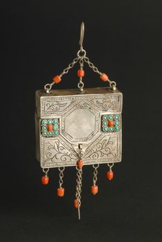 ancient antique pendant with stones on black background. Middle-Asian vintage jewelry