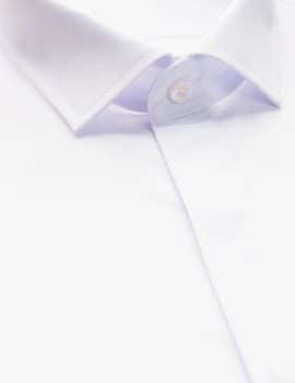 white shirt with focus on collar and button, close-up