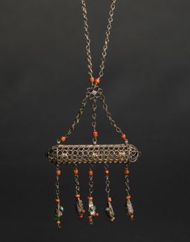 ancient antique pendant with stones on black background. Middle-Asian vintage jewelry