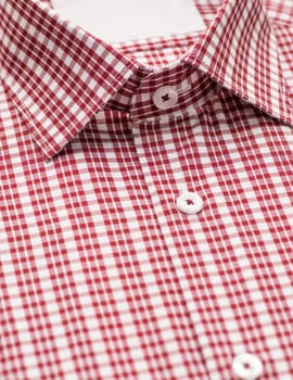 red shirt with focus on collar and button, close-up