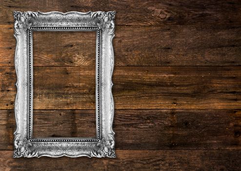 Old Silver Picture Frame on wood baclground