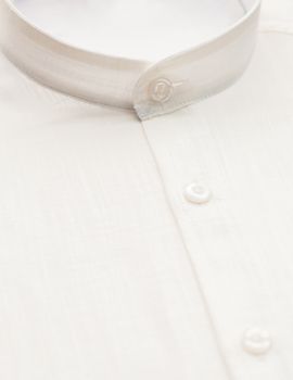 white shirt with focus on collar and button, close-up