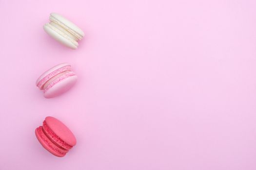 macarons on pink background, Beautiful dessert, Flat lay style with copy space to write.