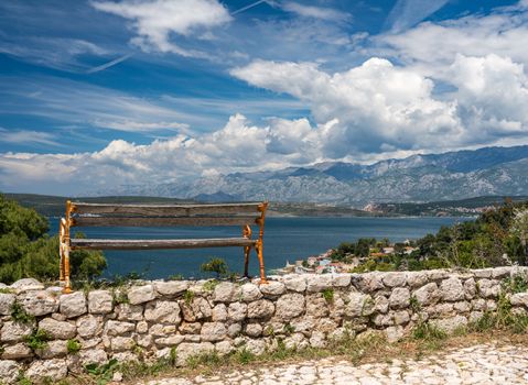 Bench on top of ruins of old Venetian fort above the coastal town of Novigrad in Croatia