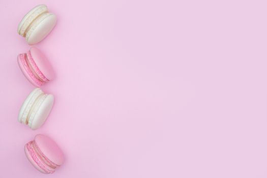 macarons on pink background, Beautiful macaroons dessert, Flat lay style with copy space to write.