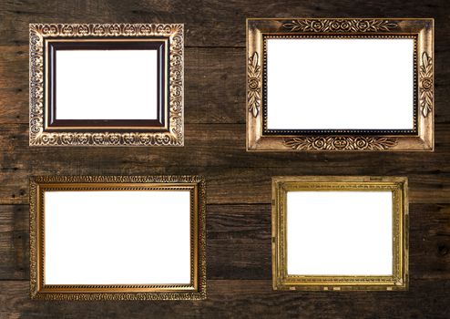 Group of Old Gold Picture Frames on wooden wall