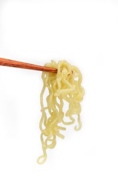 Instant noodles on chopstick isolated on white background, junk food or fast food concept.