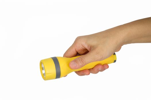 Hand holding yellow flashlight isolated on white background.