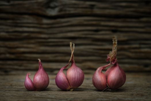 Still life with onion on rustic wooden table, Choose a focal point.